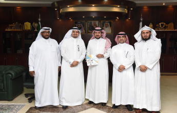 Honorable Rector of the University receives the Annual Report of the Deanship of Library Affairs